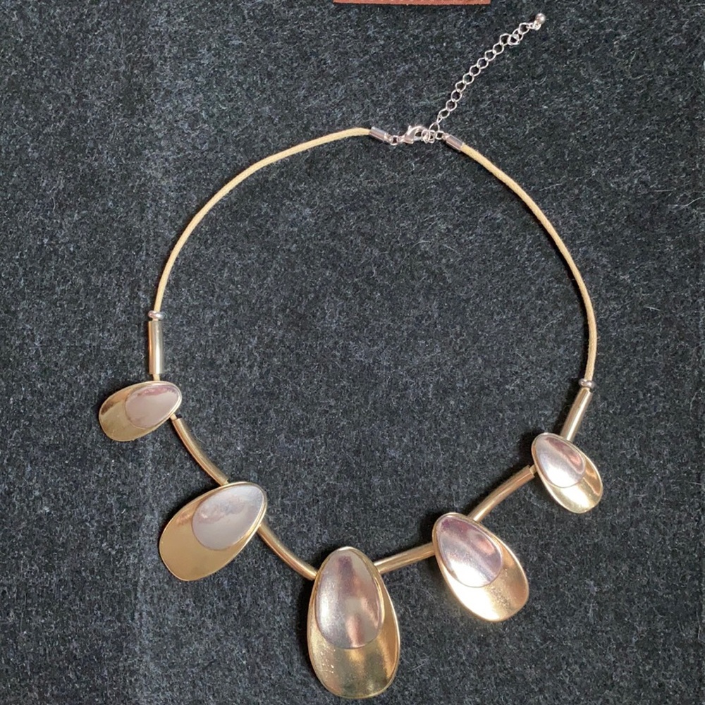 Set of gold and silver drop shape statement necklace and earrings